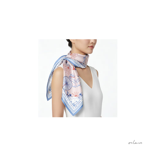 Onlewo 'Downtown' silk scarf styled — elegant Singapore city landmarks pattern, 100% mulberry silk, Singapore-designed corporate gift by Onlewo