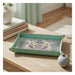 Onlewo 'Peranakan Story' leather valet tray styled — vibrant Peranakan cultural symbols on genuine leather, Singapore-designed corporate gift by Mike Tay